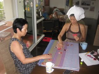 My mom and Sue playing cards (Korean hwa-toe) to see who pays for dinner.