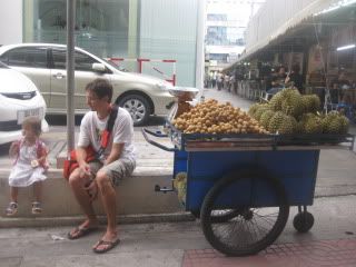 Joss and Noi naa by a longons and durian cart.