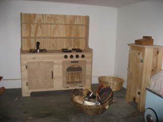 Devana and her husband made this beautiful play kitchen. Ive seen (and coveted) kitchens like this one for $350. I have got to learn how to use a saw...