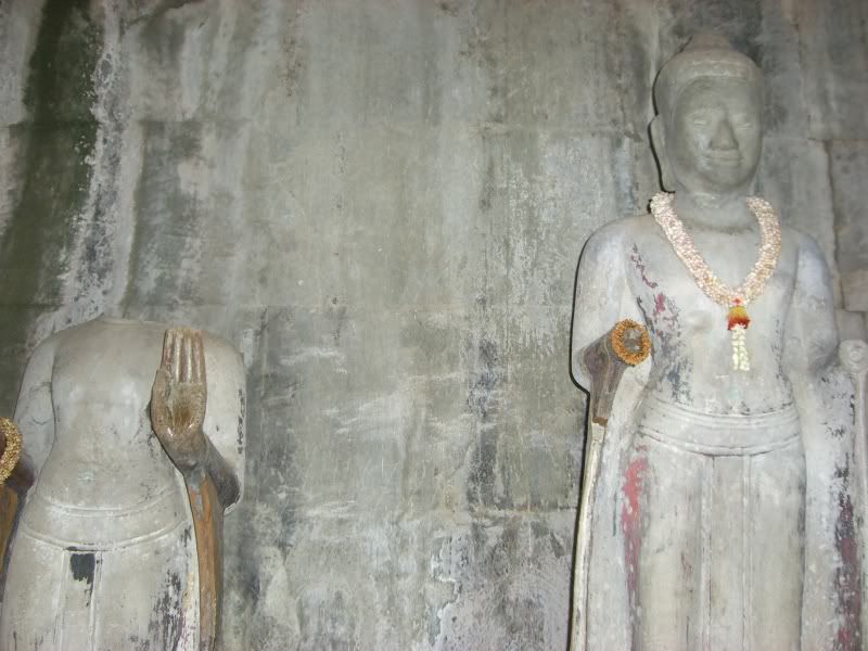 Vandalized Buddha statues