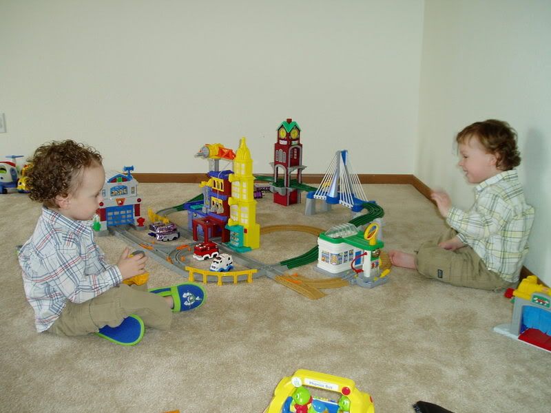 Playing with their new GeoTrax cars