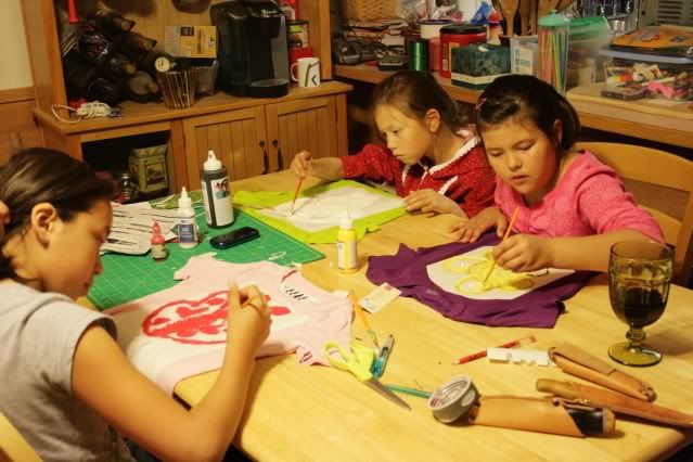 girls working on shirts