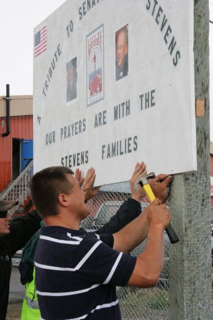 putting up the sign