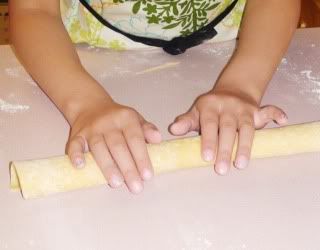 rolling the dough into a roll